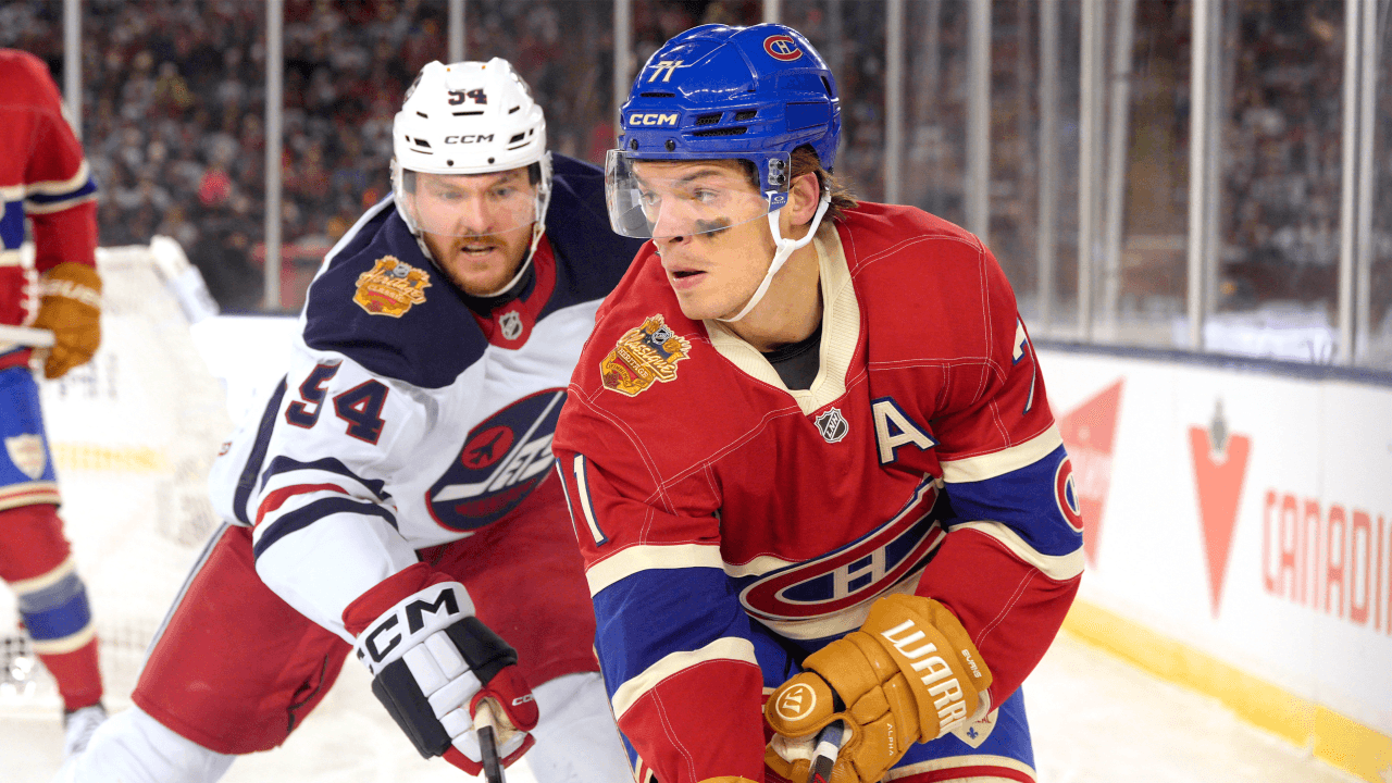 WINNIPEG, MANITOBA - OCTOBER 25: Jake Evans #71 of the Montreal Canadiens and Dylan Samberg #54 of the Winnipeg Jets skate during the third period of the 2026 NHL Heritage Classic between the Montreal Canadiens and the Winnipeg Jets at Princess Auto Stadium on October 25, 2026 in Winnipeg, Manitoba.