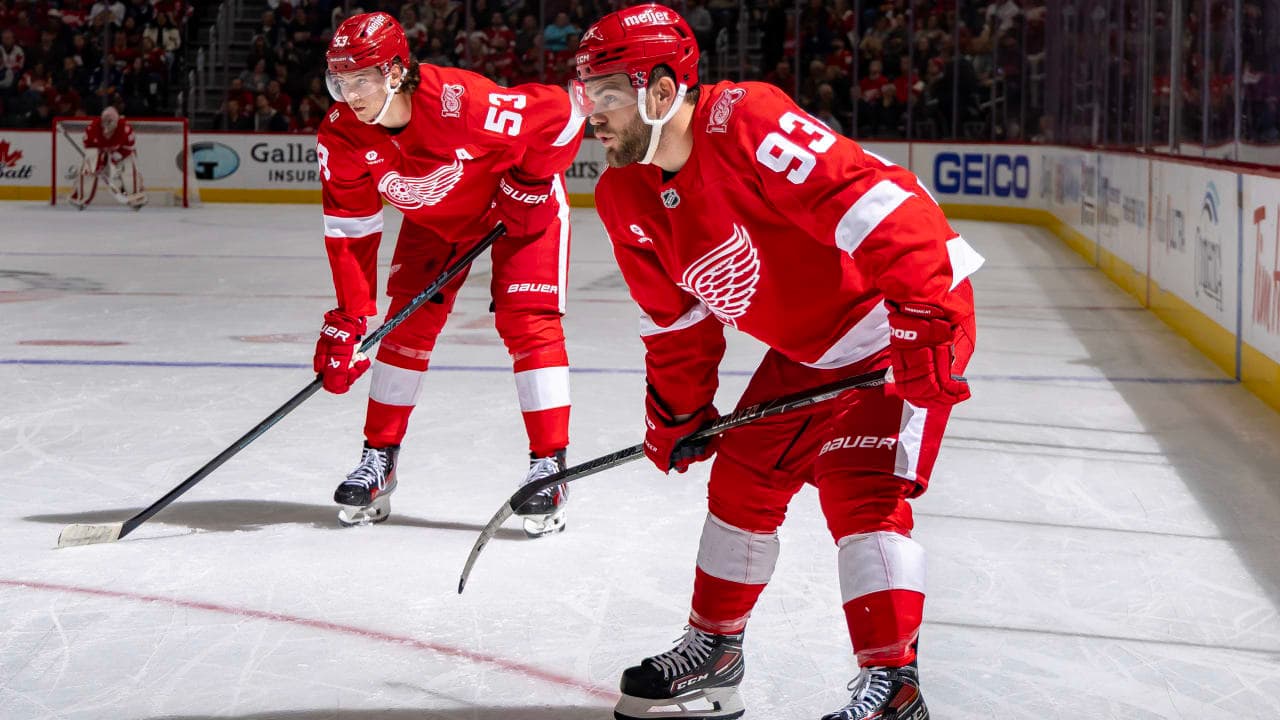 Alex Debrincat #93 and Moritz Seider #53 of the Detroit Red Wings gets set for the face-off against the Vancouver Canucks during the first period at Little Caesars Arena on January 8, 2026 in Detroit, Michigan.