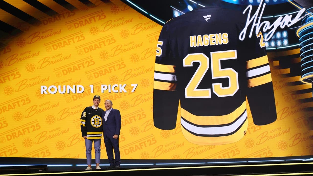 James Hagens stands with NHL commissioner Gary Bettman onstage after being selected seventh overall by the Boston Bruins at the 2025 NHL Draft at Peacock Theater on June 27, 2025 in Los Angeles, California.