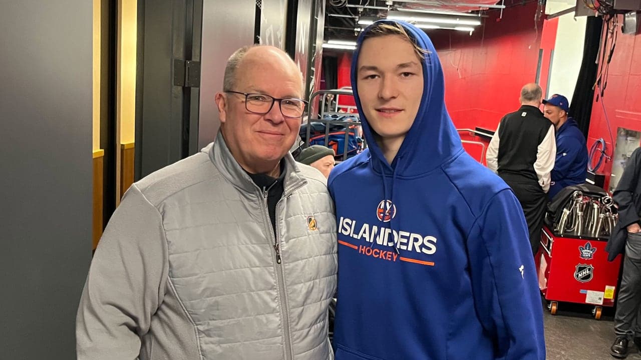Matthew Schaefer with Jim Nyhuus, one of his minor league hockey coaches