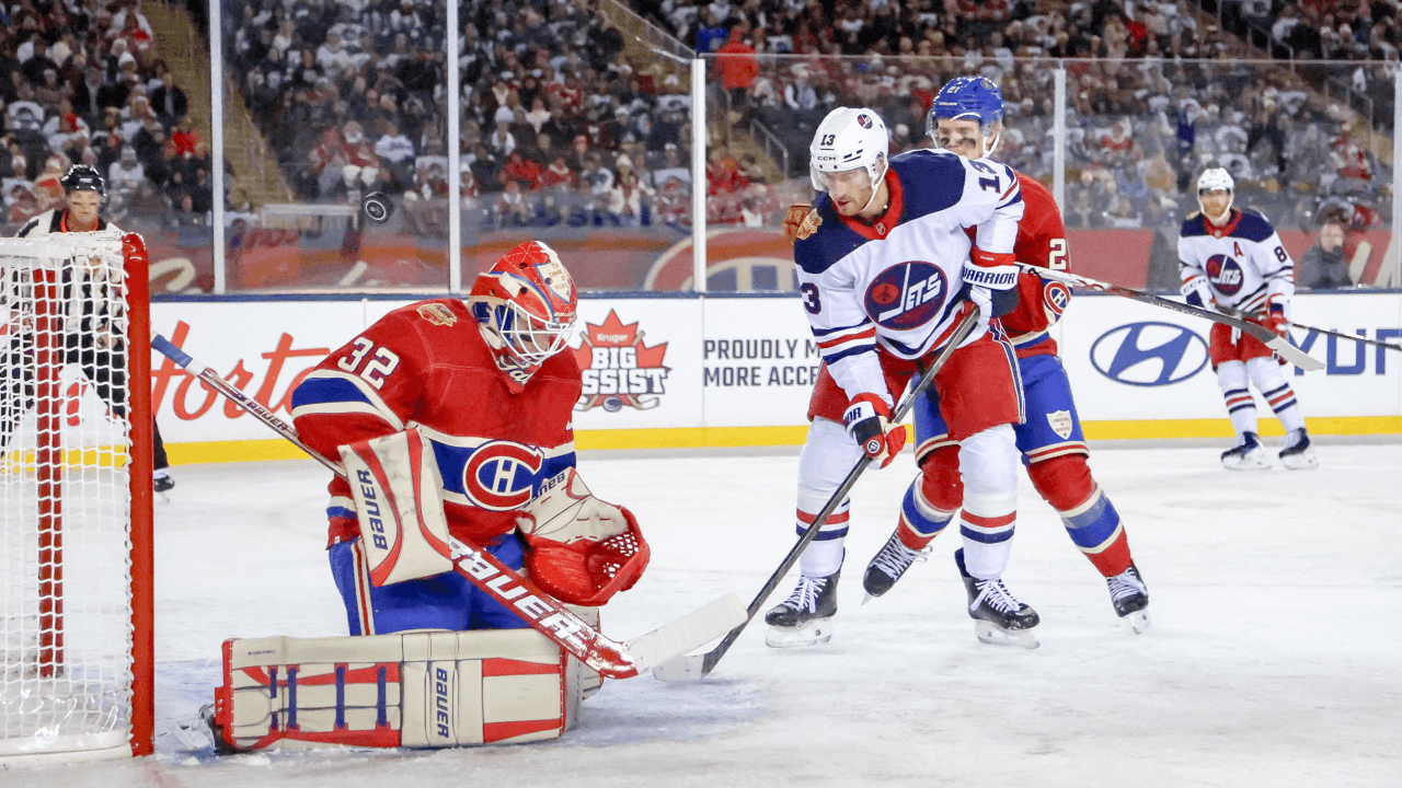 WINNIPEG, CANADA - OCTOBER 25: Goaltender Jacob Fowler #32 of the Montreal Canadiens makes a save as Gabriel Vilardi #13 of the Winnipeg Jets looks on during first period action in the 2026 NHL Heritage Classic at Princess Auto Stadium on October 25, 2026 in Winnipeg, Manitoba, Canada.