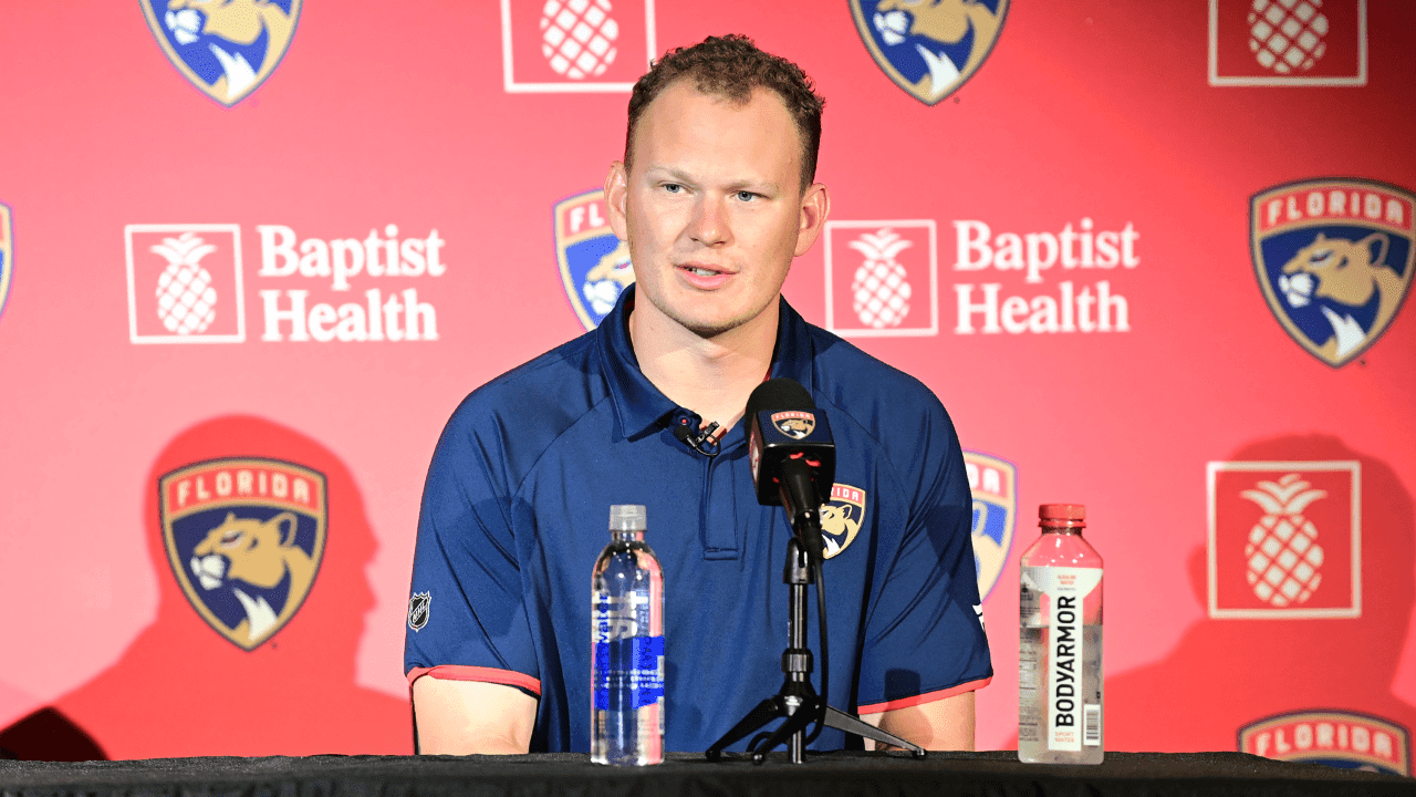 Brady Tkachuk #8 of the Florida Panthers answers a media question at his introductory press conference
