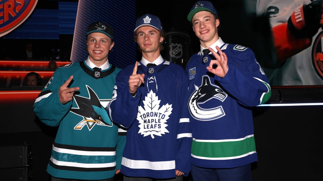 L-R) Ivar Stenberg of the San Jose Sharks, Gavin McKenna of the Toronto Maple Leafs, and Caleb Malhotra of the Vancouver Canucks pose for a picture during day one of the 2026 NHL Draft on June 26, 2026 in Buffalo, New York. 