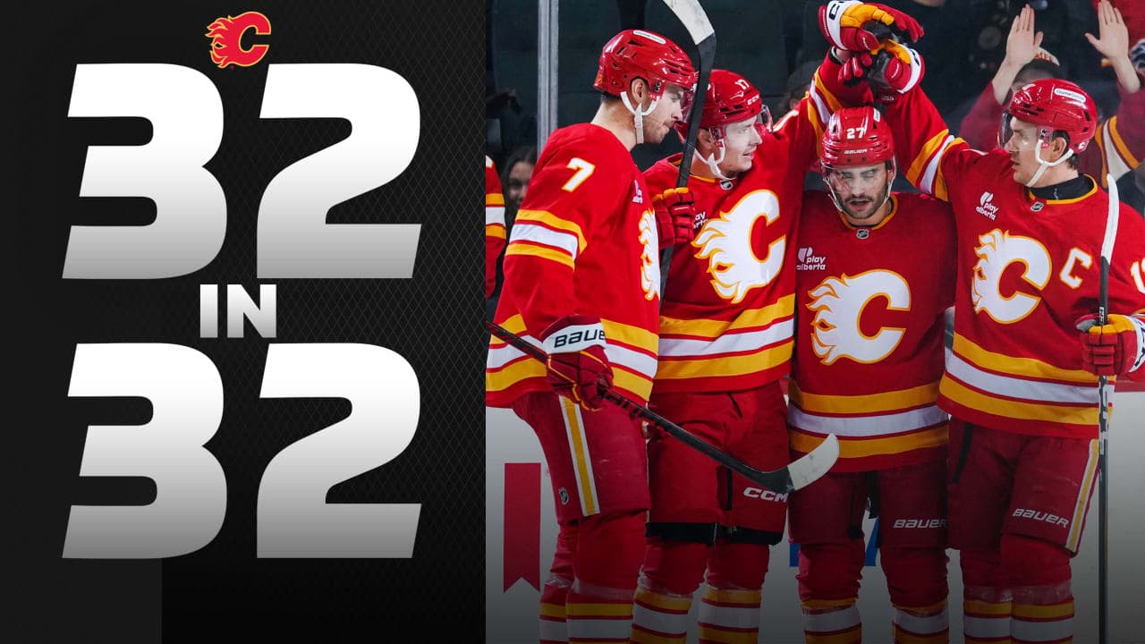 Yegor Sharangovich #17 of the Calgary Flames celebrates his first period goal against the New York Islanders with teammates Kevin Bahl #7, Matt Coronato #27 and Mikael Backlund #11 at the Scotiabank Saddledome on January 17, 2026 in Calgary, Canada. 