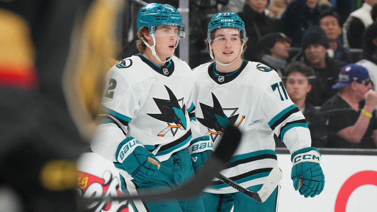 Macklin Celebrini and Will Smith celebrate goal during game last season. 