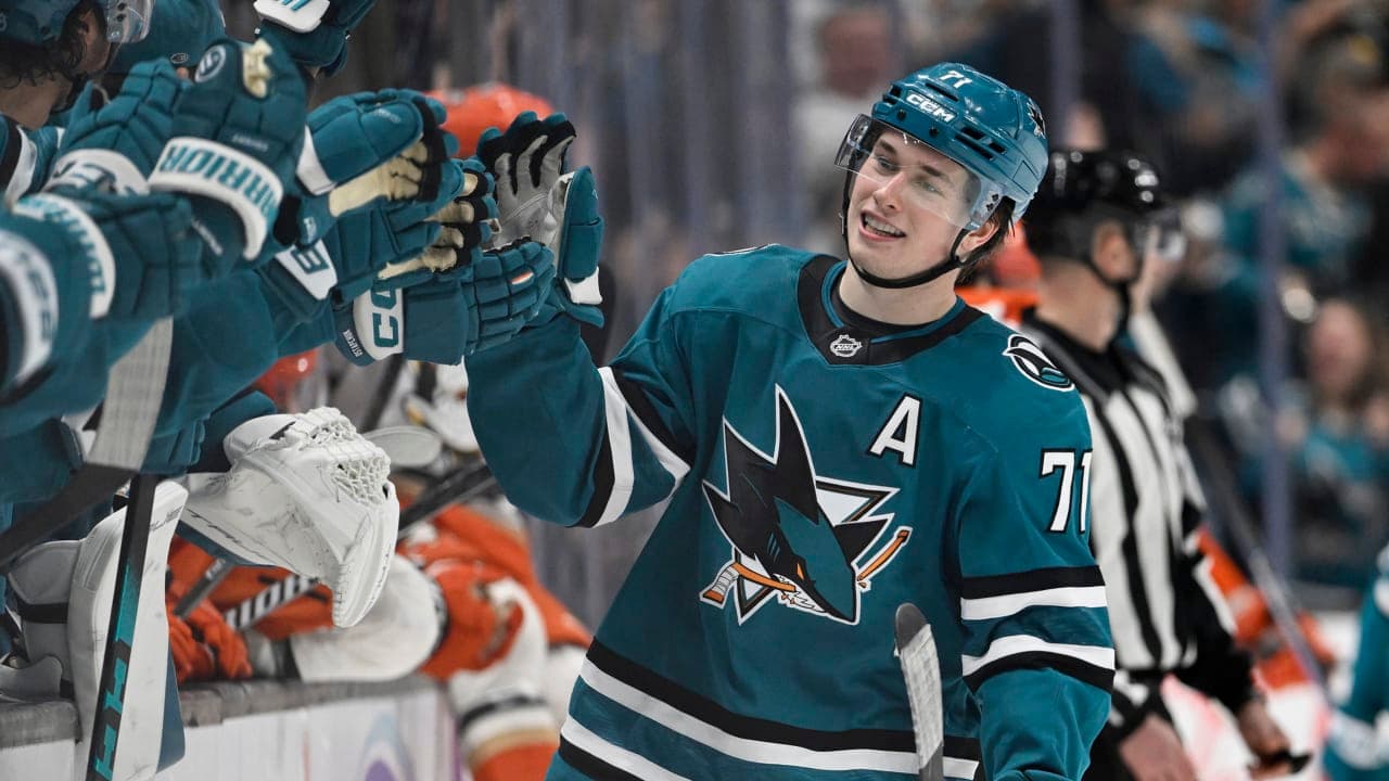 Macklin Celebrini #71 of the San Jose Sharks celebrates their goal with teammates against the Anaheim Ducks