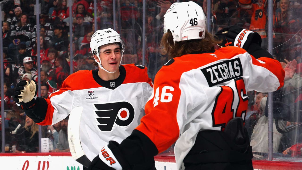 Trevor Zegras #46 of the Philadelphia Flyers celebrates his powerplay goal against the New Jersey Devils at 3:36 of the first period on an assist from Porter Martone #94 (l) at Prudential Center on April 07, 2026 in Newark, New Jersey. 