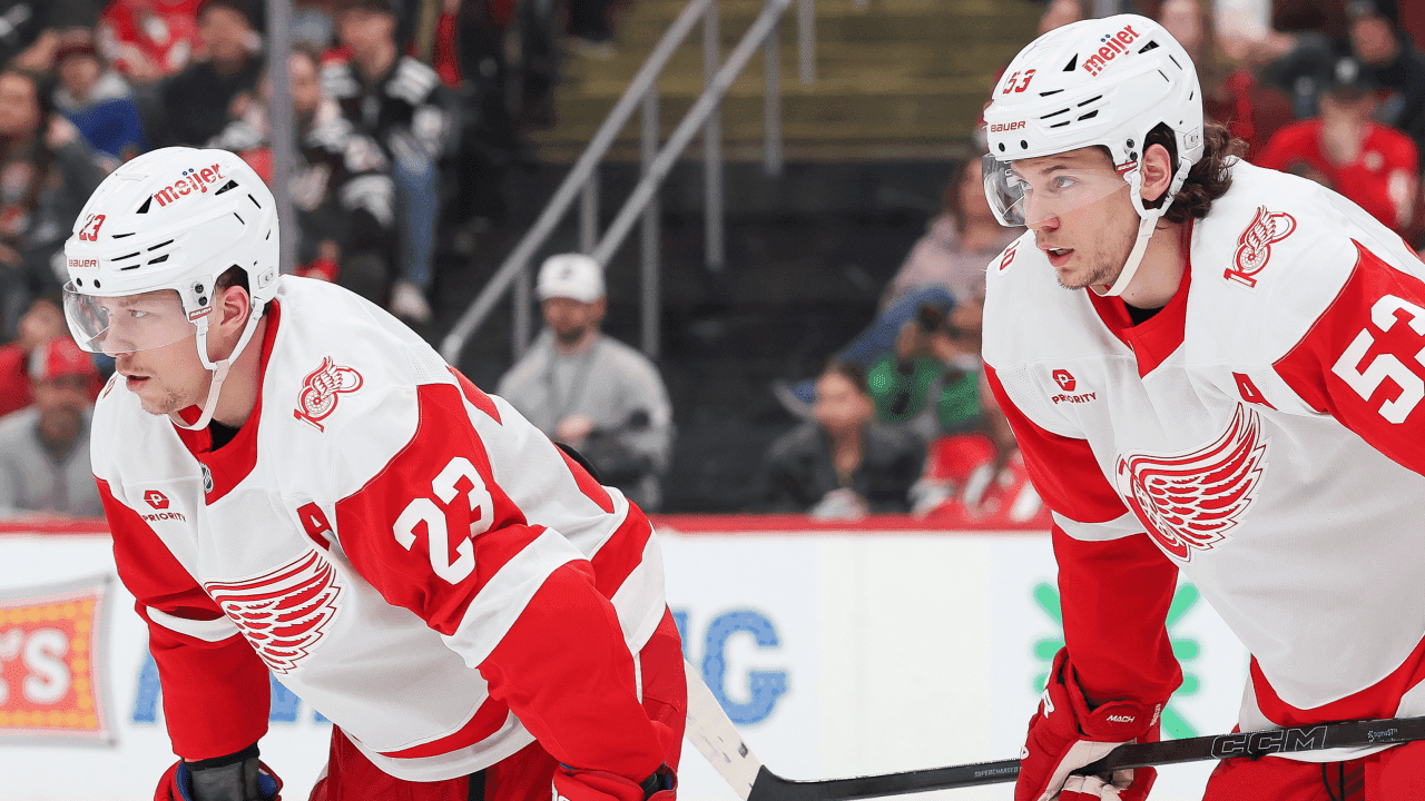 Lucas Raymond #23 of the Detroit Red Wings and Moritz Seider #53 look on