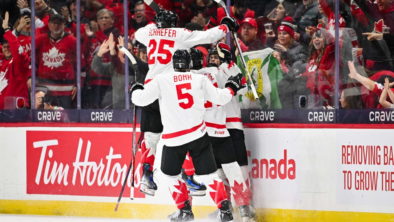 OTTAWA, CANADA - DECEMBER 26: Gavin McKenna #9 of Team Canada celebrates his goal with teammates Oliver Bonk #5 and Matthew Schaefer #25 during the first period at the 2025 IIHF World Junior Championship against Team Finland at Canadian Tire Centre December 26, 2024 in Ottawa, Ontario, Canada. (Photo by Minas Panagiotakis/Getty Images)