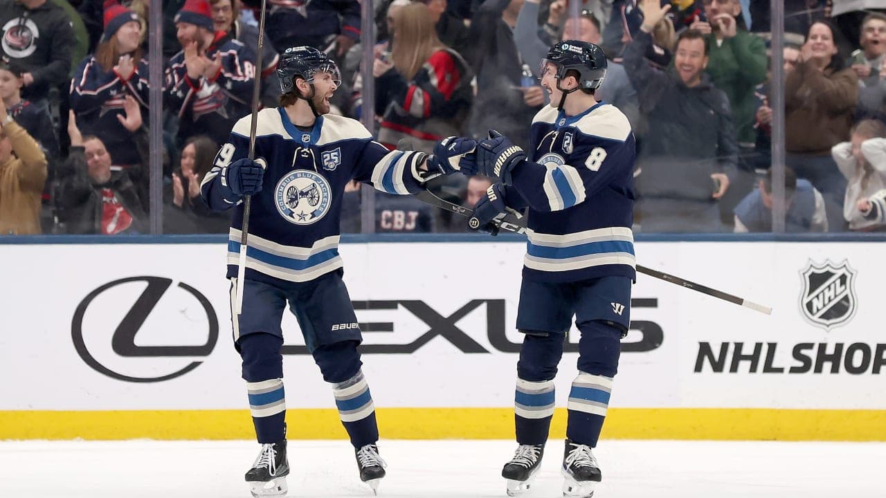 Adam Fantilli #19 of the Columbus Blue Jackets is congratulated by Zach Werenski #8 after scoring a goal during the game against the New York Rangers at Nationwide Arena on March 19, 2026 in Columbus, Ohio.