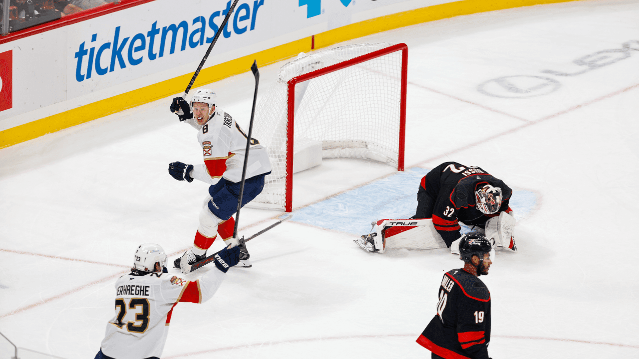RALEIGH, NORTH CAROLINA - SEPT 29: Carter Verhaeghe #23 and Brady Tkachuk #8 of the Florida Panthers react after teammate Gustav Forsling #42 (not pictured) scored the overtime game-winning goal against Brandon Bussi #32 of the Carolina Hurricanes during the last seconds of overtime at Lenovo Center on September 29, 2026 in Raleigh, North Carolina.