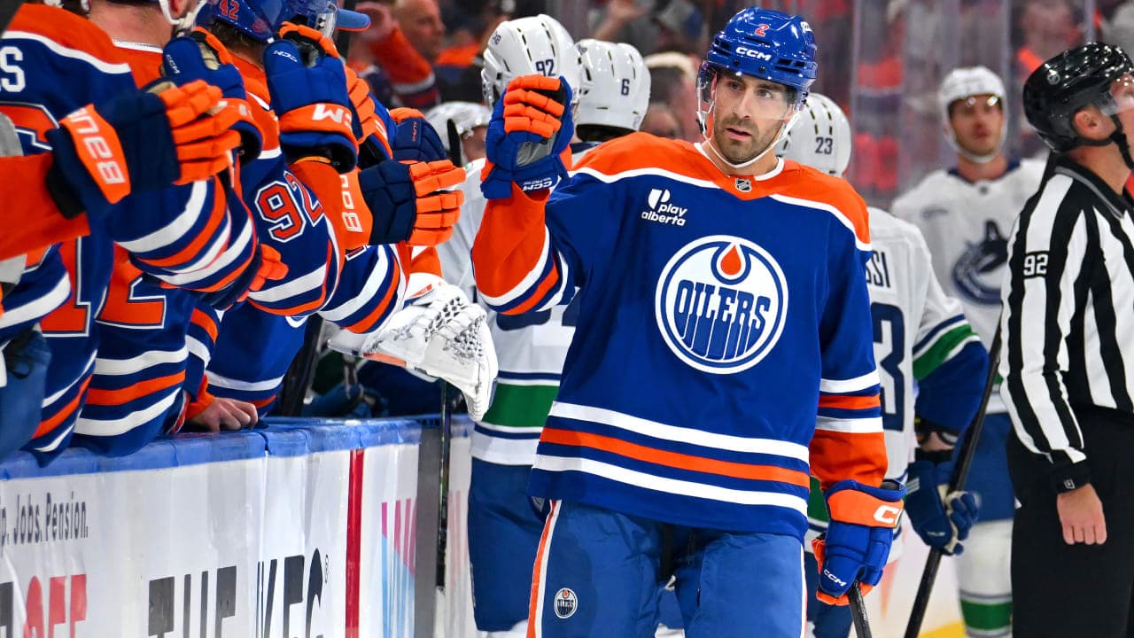 Evan Bouchard #2 of the Edmonton Oilers celebrates a first-period goal at the bench during the game against the Vancouver Canucks at Rogers Place on September 29, 2026, in Edmonton, Alberta, Canada.