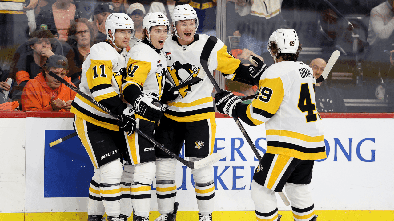 Ville Koivunen #41 of the Pittsburgh Penguins celebrates his goal with Filip Hallander #11, Kaedan Korczak #6 and Samuel Girard #49 