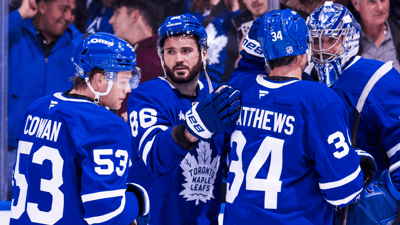 Anthony Stolarz #41, Auston Matthews #34, Kirill Marchenko #86, and Easton Cowan #53 of the Toronto Maple Leafs celebrate after defeating the New York Islanders following their NHL game at Scotiabank Arena on September 30, 2026 in Toronto, Canada.