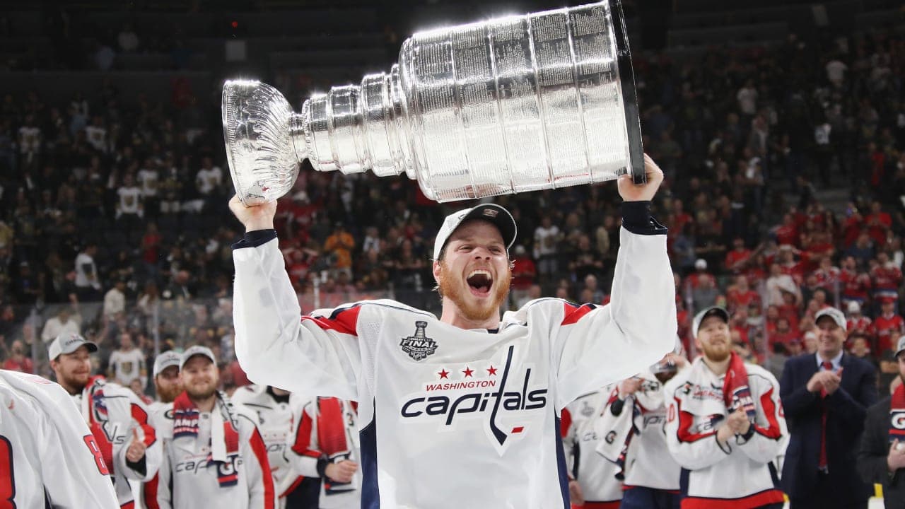 LAS VEGAS, NV - JUNE 07: John Carlson #74 of the Washington Capitals carries the Stanley Cup in celebration after his team defeated the Vegas Golden Knights 4-3 in Game Five of the 2018 NHL Stanley Cup Final at the T-Mobile Arena on June 7, 2018 in Las Vegas, Nevada. (Photo by Bruce Bennett/Getty Images)