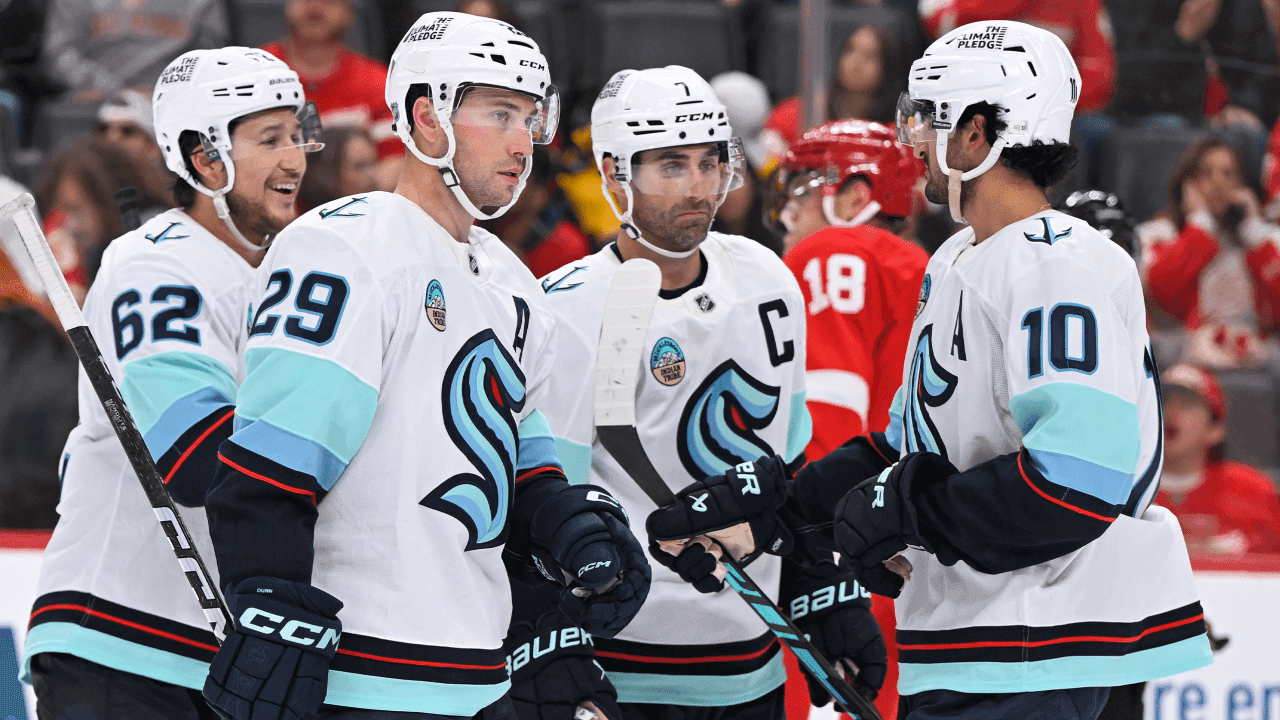 DETROIT, MI - OCTOBER 09: Seattle Kraken defenseman Vince Dunn (29) celebrates his goal in the third period with teammates during game between Seattle Kraken and Detroit Red Wings on October 9, 2026 at Little Caesars Arena in Detroit, MI