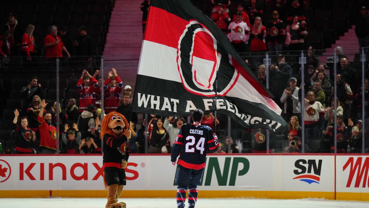 Dylan Cozens #24 of the Ottawa Senators salutes the crowd 
