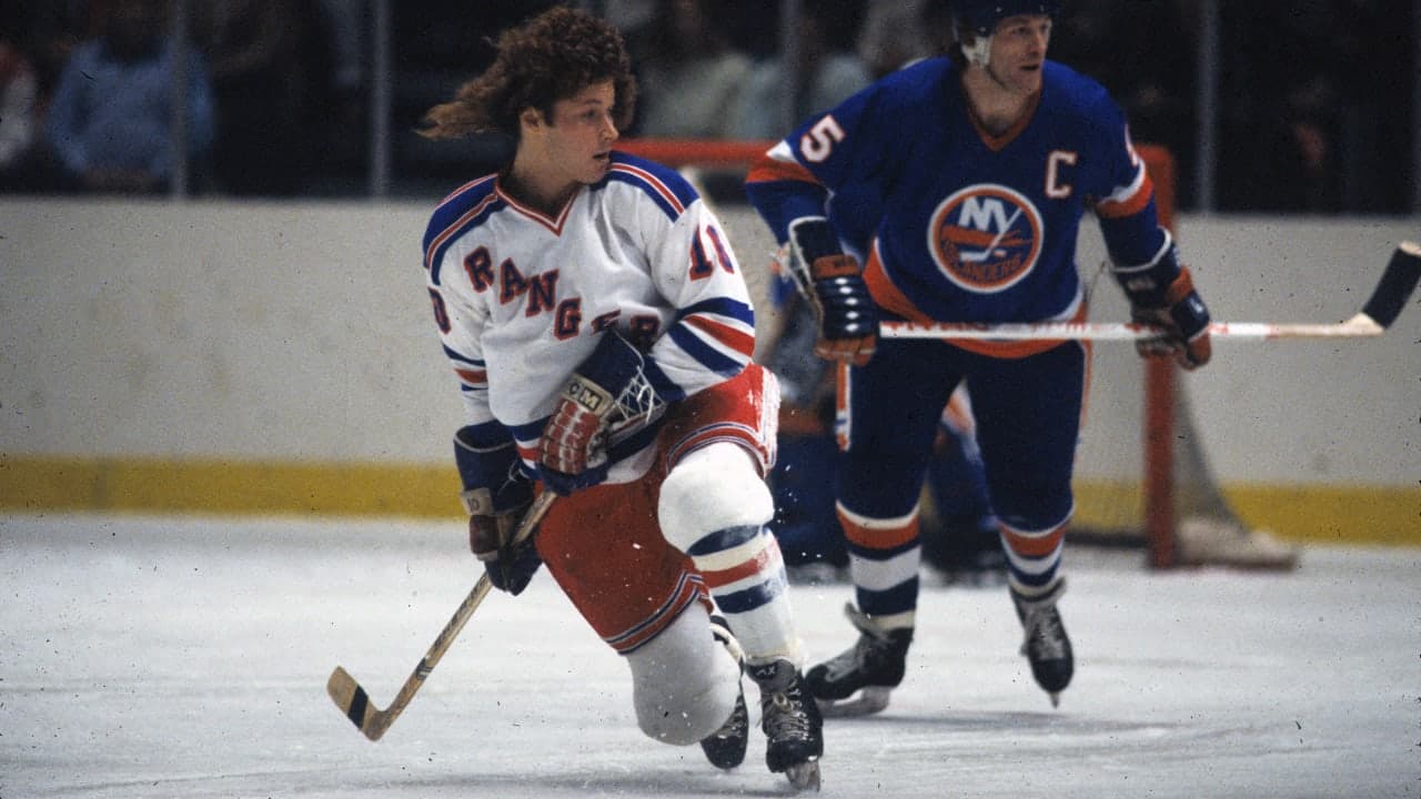 Ron Duguay #10 of the New York Rangers and Denis Potvin #5 of the New York Islanders during 1981-82 game action at Madison Square Garden in New York, NY USA.