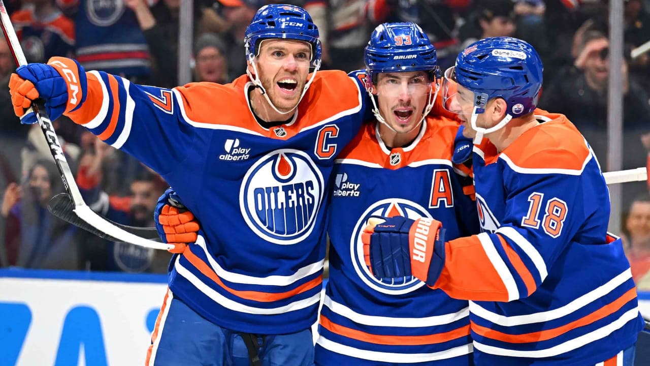Connor McDavid #97, Zach Hyman #18 and Ryan Nugent-Hopkins #93 of the Edmonton Oilers celebrate a second-period goal against the Carolina Hurricanes during the game at Rogers Place on October 22, 2026, in Edmonton, Alberta, Canada. 