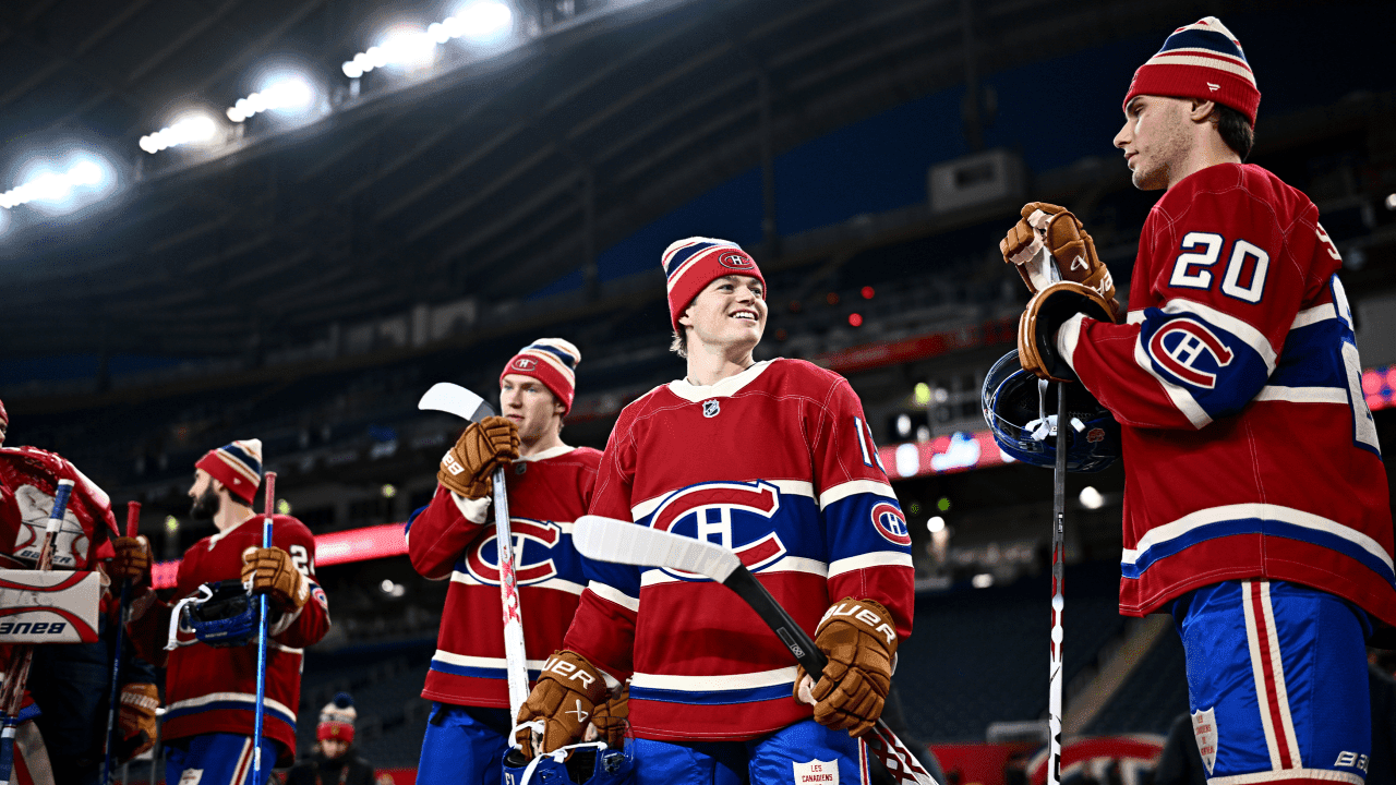 Cole Caufield #13 and Juraj Slafkovsky #20 of the Montreal Canadiens wait to take the ice 