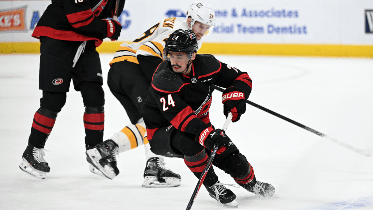 Right Wing Seth Jarvis (24) of the Carolina Hurricanes keeps the puck onside at the blue line during the NHL game between the Boston Bruins and the Carolina Hurricanes on April 7, 2026 at Lenovo Center in Raleigh, North Carolina.